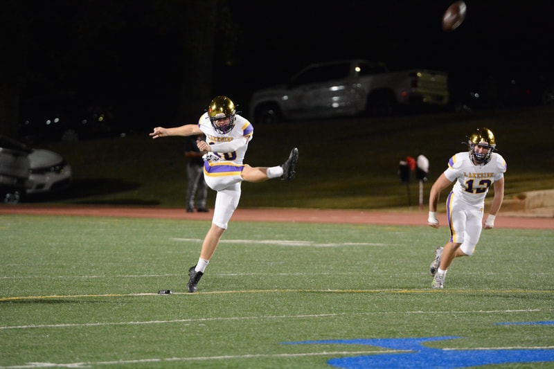 #10 booms a kick downfield